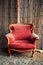 Abandoned vintage red armchair
