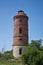 Abandoned vintage ruined water tower of red brick