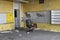 Abandoned vintage yellow classroom with office chair
