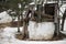 Abandoned well is damaged coating in the midst of the court uninhabited house