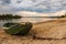 Abandoned wooden boat on the river shore.