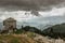 Abandoned wooden house.Old homestead home in a remote area. Amazing view of the mountains and wild nature.Green valley. Trekking