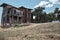 Abandoned wooden made house, low angle brownfield house.