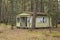 Abandoned wooden mobile homes in a forgotten, abandoned holiday resort on an autumn day. Mess