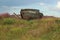 Abandoned wooden ship with the inscription titanic on the grass