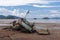 Abandoned wrecked fishing boat by the sea on a cloudy day. Scenic sea-side view.