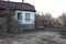 Abandoned yard old house and stable in the mountains in autumn time