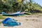 Abandonned artistic wooden canoe on a lonely beach