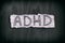 Abbreviation ADHD on black background