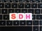 Abbreviation SDH on keyboard background