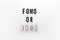 Abbreviation words FOMO, JOMO on transparent plastic on white background. FOMO means Fear Of Missing Out. JOMO - Joy Of Missing