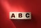 ABC letters wooden blocks on red. Education concept