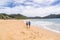 Abel Tasman National Park beach tourists hikers tramping on coast track trail, famous travel destinatinon. Wilderness reserve at