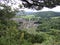 Abergele village in wales, overlooking the town with mountains on the horizon, framed with trees in summer, North Wales UK