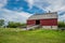 Abernethy, SK- Aug. 21, 2022: Sheep grazing outside W. R. Motherwellâ€™s historic barn