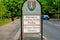 Abington park entrance sign between footpath and road in northampton england uk