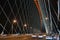 Ð¡able-stayed through arch bridge over river Ob in Novosibirsk at night, Siberia