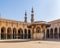 Ablution fountain mediating courtyard of mosque of Sultan al Muayyad, arched corridors, and minarets, Cairo, Egypt