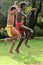 Aboriginal Australians men dancing traditional dance during Australia Day celebrations