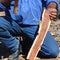 Aboriginal building a boomerang