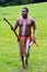 Aboriginal warrior man carry boomerangs