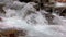Abounding river detail with close up of rock, in Spanish Pyrenees mountains