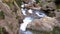 Abounding river detail with close up of rock, in Spanish Pyrenees mountains