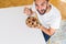 Above angle of handsome man eating healthy cereals for breakfast in the morning