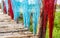 Above, a close-up view, a plethora of eucalyptus bridges adorned with brightly colored twigs