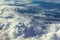 Above heaven concept, view from airplane to fluffy white clouds and blue atmosphere, nature skyline landscape
