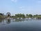 Above the river surface, there is a dam made of stones