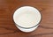 Above of round ceramic bowl, tableware white dish isolated on table background