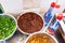 above view of bowls with spicy toppings on kitchen