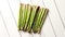 Above view of flat-lay organic raw uncooked green asparagus