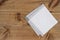 Above view of folded linen napking on wooden texture background