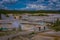 Above view of people walking in the boardwalk among pools and geysers, porcelain basin of Norris Geyser Basin