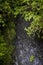 Above View of river running among rocky clifs covered with green moss