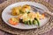 An above view of steak and asparagus with jumbo prawns and roasted potatoes.