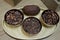 Above view of toasted cacao beans in bowls