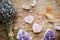 Above view of two polished pink color rose quartz crystals on wood tray in home. Attract love, healing heart chakra concept.