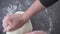 Above view of woman hands kneading dough