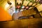 The above view of the wooden staircases in the cafe decorated with wooden shelves full of barrels, plants and bottles