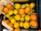 Above view of yellow and orange lemons on a stall