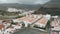 Above. The village at the foot of the misty mountains - white houses with an orange roof, Spanish architecture, holiday