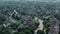 Above wide aerial view. Residential houses in suburbs near city .