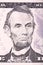 Abraham Lincoln portrait from five dollars bill.