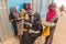 ABRI, SUDAN - FEBRUARY 27, 2019: Young peanut sellers at a petrol station near Abri, Sud