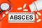 Abscess-the inscription of the text of the diagnosis in the form in the medical folder. Tissue inflammation and formation of a