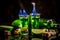 Absinthe poured into a glass. in the background is a bottle of absinthe with brown sugar and lime isolated on black background.