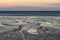 Absolutely beautiful landscape images of Holywell Bay beach in Cornwall UK during golden hojur sunset in Spring